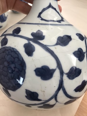 Lot 235 - A PAIR OF CHINESE BLUE AND WHITE VASES.