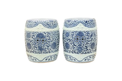 Lot 311 - A PAIR OF CHINESE BLUE AND WHITE BARREL STOOLS.