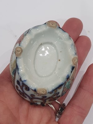 Lot 198 - A SMALL CHINESE FAMILLE ROSE JAR AND COVER.