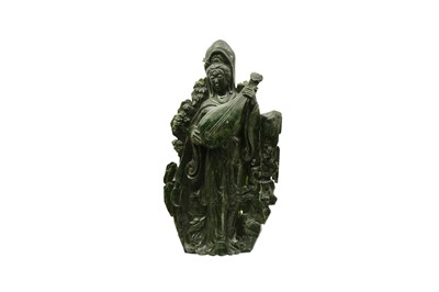 Lot 582 - A VERY LARGE CHINESE SPINACH JADE FIGURE OF GUANYIN.