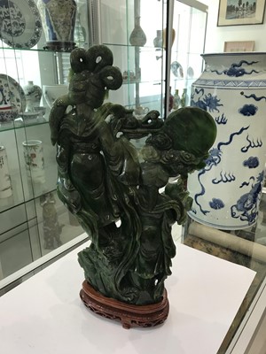Lot 583 - A LARGE CHINESE SPINACH JADE CARVING OF TWO CELESTIAL LADIES.