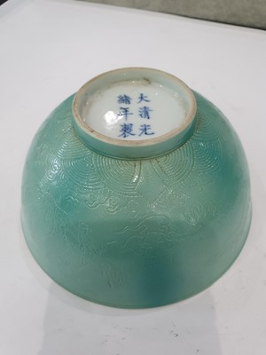 Lot 773 - A PAIR OF CHINESE GREEN-GLAZED INCISED 'DRAGON' BOWLS.