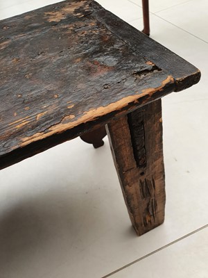 Lot 823 - A TIBETAN LOW POLYCHROMED WOOD OFFERING TABLE.