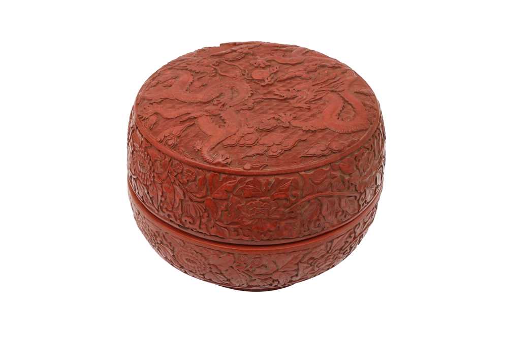 Lot 797 - A CHINESE CINNABAR LACQUER STYLE 'DRAGON' BOX AND COVER.