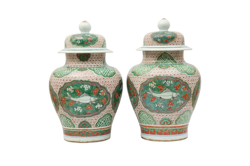 Lot 778 - A PAIR OF CHINESE FAMILLE VERTE 'FISH' BALUSTER VASES AND COVERS.