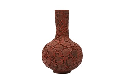 Lot 796 - A CHINESE CINNABAR LACQUER STYLE 'PEACHES' BOTTLE VASE.