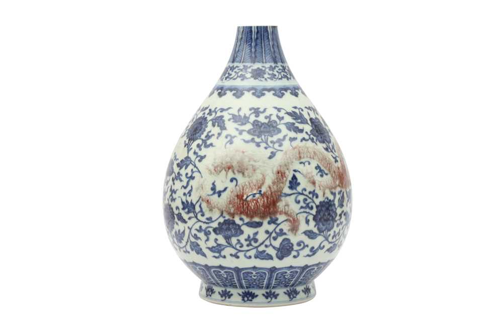 Lot 761 - A CHINESE BLUE AND WHITE AND UNDERGLAZE RED 'DRAGON' VASE.