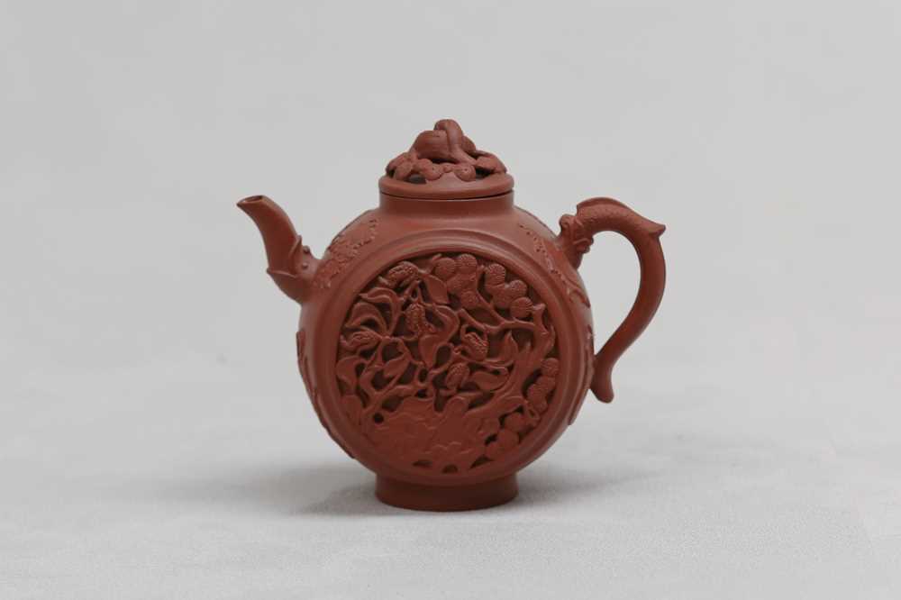 Lot 11 - A CHINESE MOONFLASK-SHAPED YIXING ZISHA TEAPOT AND COVER.