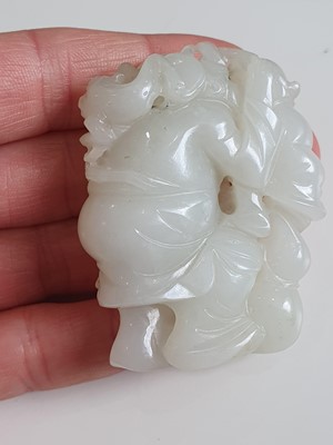 Lot 177 - A GROUP OF FOUR CHINESE PALE CELADON JADE FIGURES.