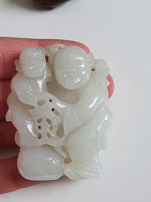 Lot 177 - A GROUP OF FOUR CHINESE PALE CELADON JADE FIGURES.