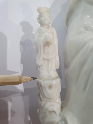 Lot 55 - A CHINESE BLANC-DE-CHINE 'GUANYIN AND CHILD' GROUP.