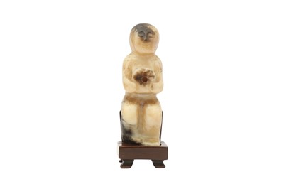 Lot 188 - A CHINESE BLACK JADE CARVING OF A FIGURE.