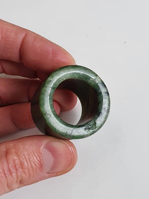 Lot 193 - A GROUP OF SEVEN JADE ARCHER'S RINGS.
