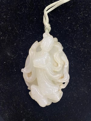 Lot 189 - A CHINESE CARVED JADE ‘CHANG’E AND RABBITS’ GROUP.