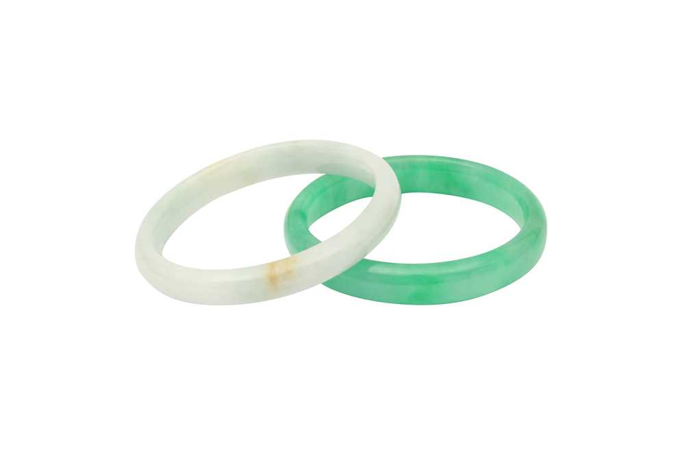 Lot 194 - TWO CHINESE JADEITE BANGLES.