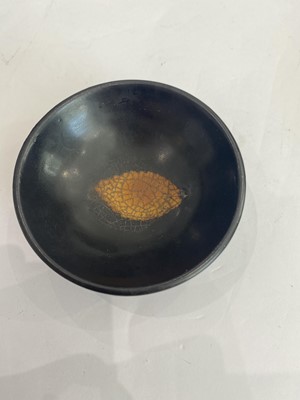 Lot 670 - A CHINESE BLACK-GLAZED 'LEAF' BOWL.