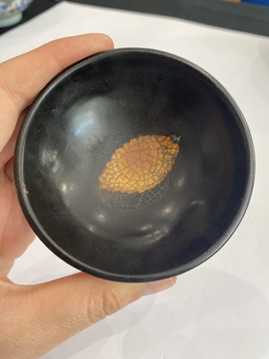 Lot 670 - A CHINESE BLACK-GLAZED 'LEAF' BOWL.