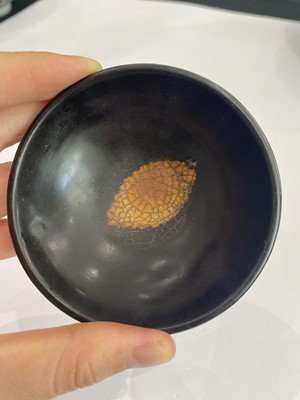 Lot 670 - A CHINESE BLACK-GLAZED 'LEAF' BOWL.