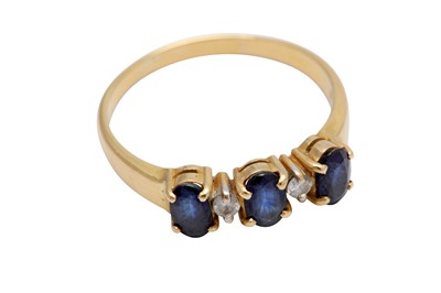 Lot 70 - A five-stone sapphire and diamond ring