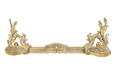Lot 174 - A ROCOCO STYLE BRASS CHENET