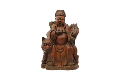 Lot 523 - A CHINESE WOOD FIGURE OF THE GOD OF TREASURE.