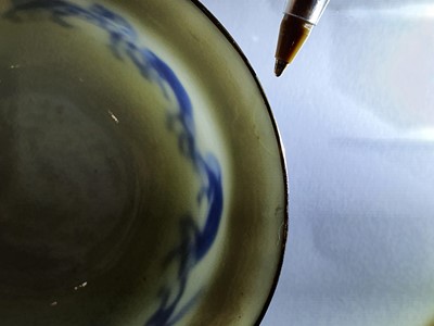 Lot 363 - A VIETNAMESE BLUE AND WHITE 'HORSES' CUP.