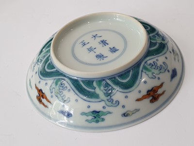 Lot 245 - A PAIR OF CHINESE DOUCAI 'DRAGON' SAUCER DISHES.