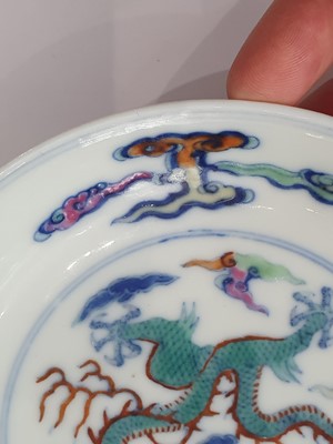 Lot 245 - A PAIR OF CHINESE DOUCAI 'DRAGON' SAUCER DISHES.