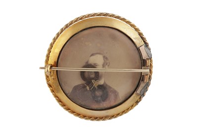 Lot 6 - A 19th century garnet, enamel and diamond brooch