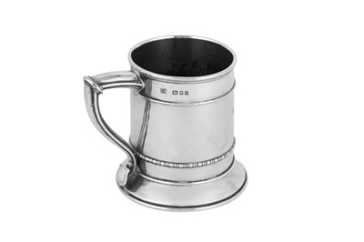 Lot 439 - A George V ‘Arts and Crafts’ sterling silver mug, London 1930 by Omar Ramsden (1873-1939)