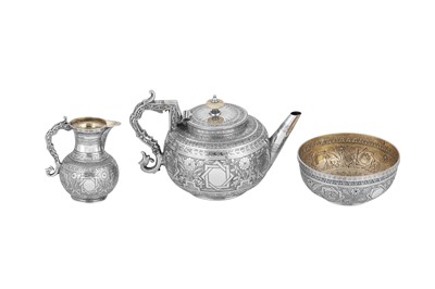 Lot 539 - A Victorian sterling silver ‘aesthetic movement’ three-piece tea service, London 1883 by William and George Sissons