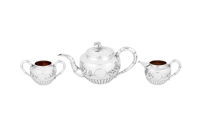 Lot 232 - An early 20th century Chinese Export silver three-piece tea service, Shanghai circa 1910 retailed by Qi Chang