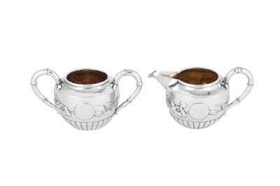 Lot 232 - An early 20th century Chinese Export silver three-piece tea service, Shanghai circa 1910 retailed by Qi Chang