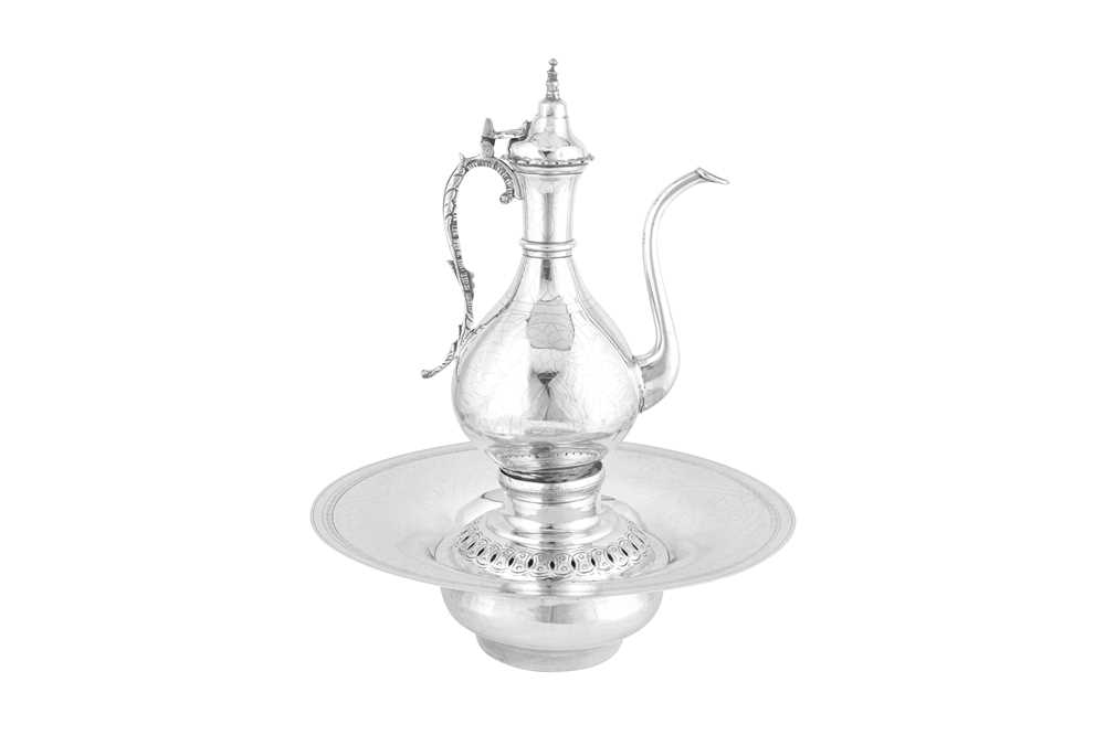 Lot 251 - A large late 19th century / early 20th century Egyptian unmarked silver coffee pot and warming stand, probably Cairo circa 1900