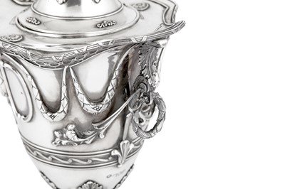 Lot 500 - An Edwardian sterling silver twin handled covered vase or cup, London 1907 by George Fox