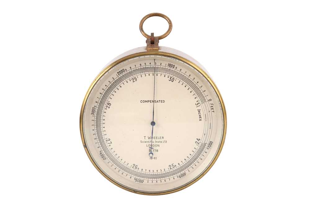 Lot 353 - A BRITISH MILITARY SURVEYING ANEROID BAROMETER BY T WHEELER, 1940