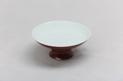 Lot 104 - A CHINESE COPPER RED-GLAZED STEM DISH.