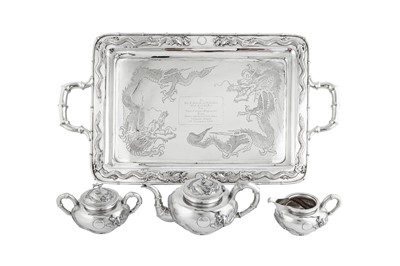 Lot 235 - An early 20th century Chinese Export silver three-piece tea service on a twin handled tray, Shanghai dated 1926 retailed by Zee Woo