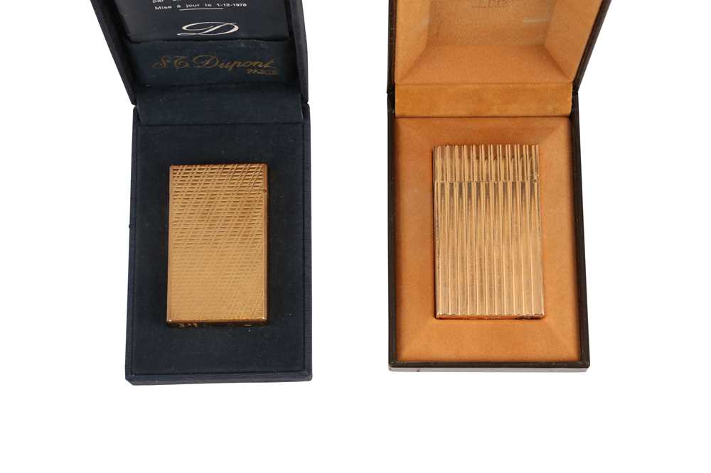 Lot 64 - TWO ST DUPONT GOLD PLATED LIGHTERS, 20TH CENTURY