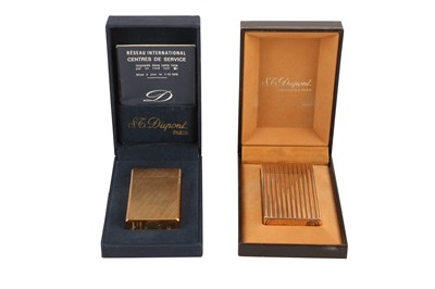Lot 64 - TWO ST DUPONT GOLD PLATED LIGHTERS, 20TH CENTURY