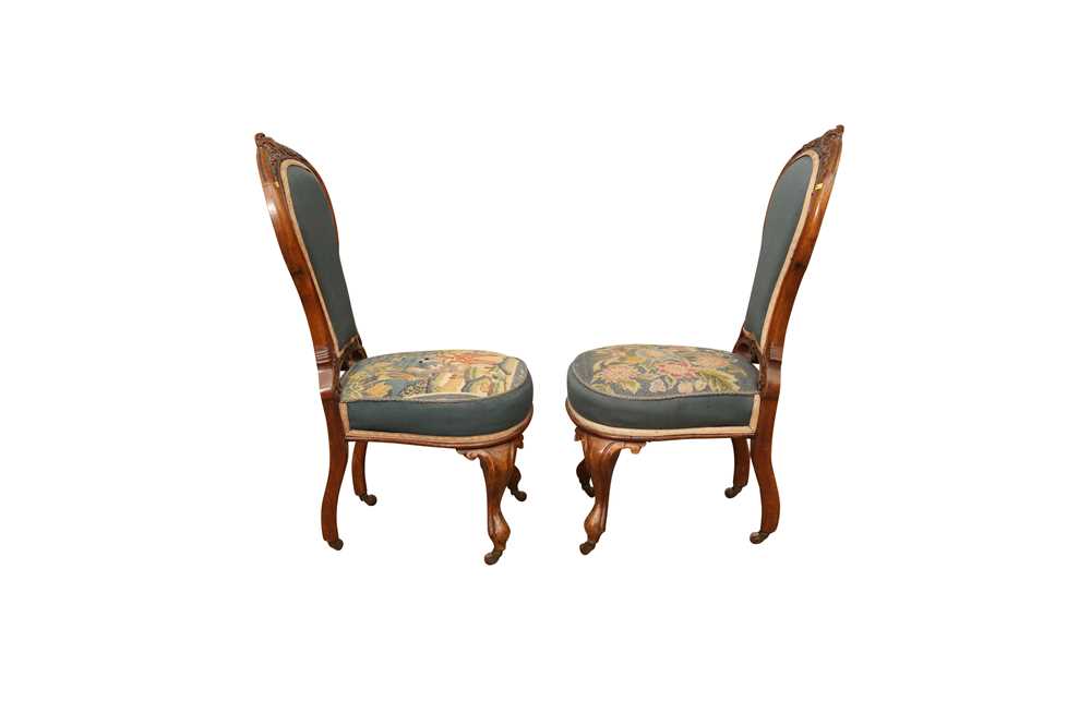 Lot 186 A PAIR OF VICTORIAN WALNUT NURSING CHAIRS,