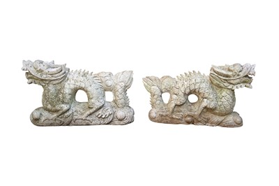 Lot 250 - A PAIR OF CONTEMPORARY RECONSTITUTED STONE GARDEN ORNAMENTS IN THE FORM OF CHINESE DRAGONS