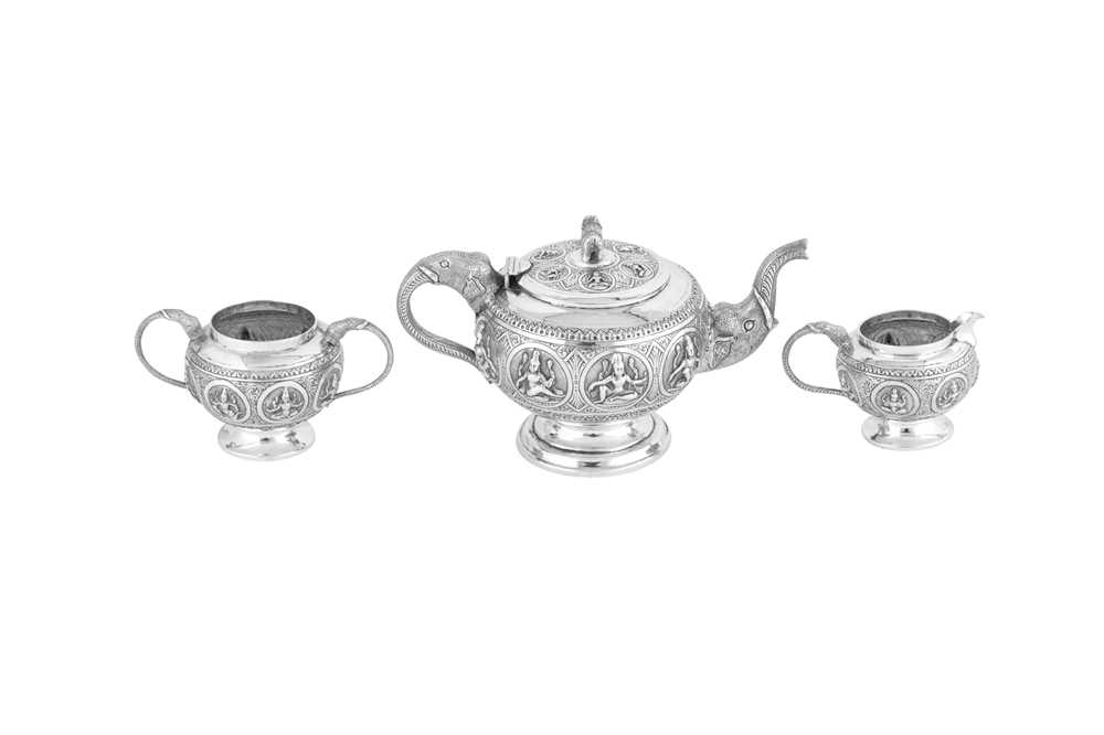 Lot 117 - An early 20th century Anglo – Indian unmarked silver three-piece tea service, Madras circa 1920