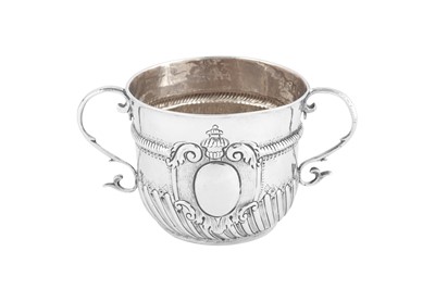 Lot 687 - A William III Britannia standard silver twin handled porringer or cup, London 1700 by Edward Wimans
