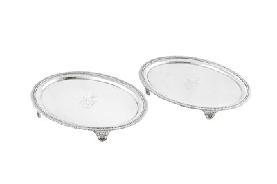 Lot 619 - A pair of George III sterling silver salvers, London 1801 by Thomas Hannam and John Crouch II (reg. 13th May 1799)