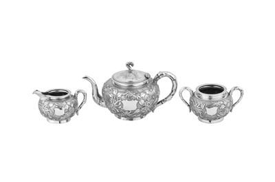 Lot 230 - An early 20th century Chinese Export silver three-piece tea service, Shanghai circa 1920 retailed by Zee Wo