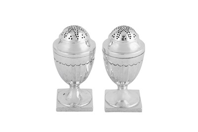 Lot 545 - A pair of George III sterling silver peppers, London 1802 by William Abdy II