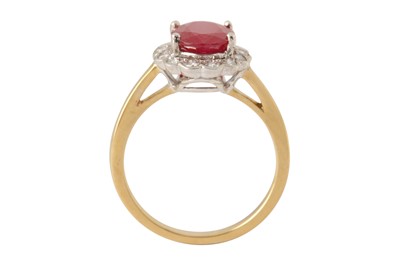 Lot 190 - A ruby and diamond cluster ring