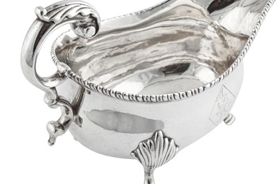 Lot 636 - A pair of George III sterling silver sauce boats, London 1773 by William Brind (this mark reg. 11th Oct 1757)
