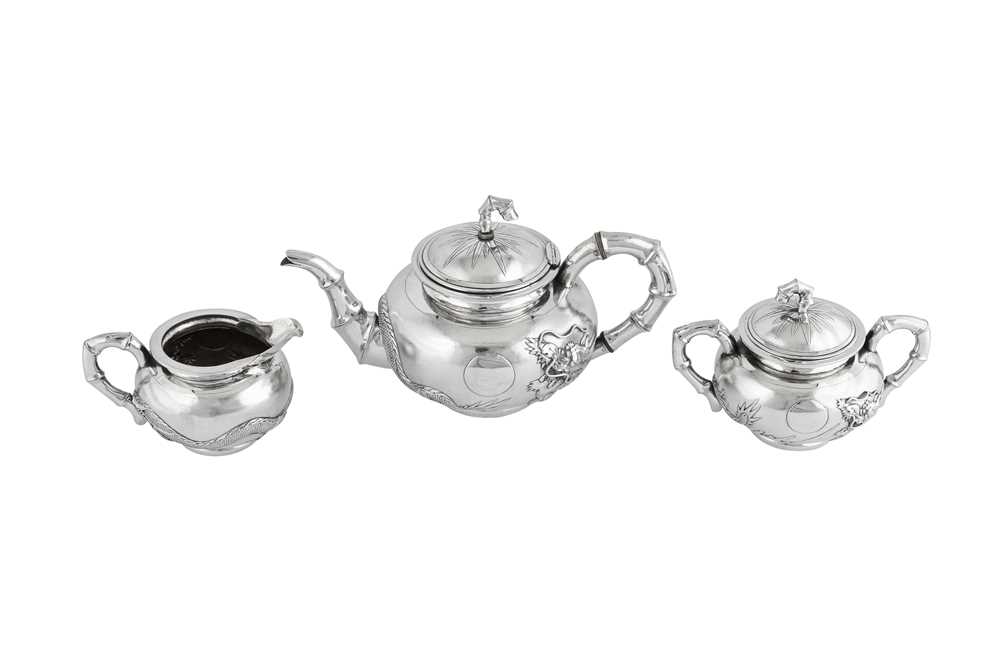 Lot 234 - An early 20th century Chinese Export silver three-piece tea service, Shanghai circa 1910 retailed by Zee Wo